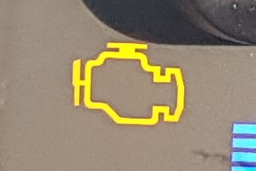 Warning light that looks like an engine.